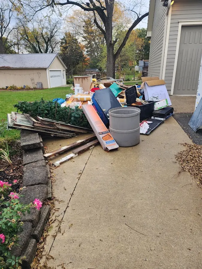Dumpster being loaded with debris for 10 Yard Dumpster Rental in Maltby